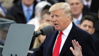 Trump giving a speech at a political rally