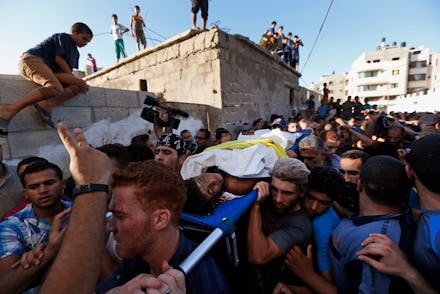 Palestinians protesting the gaza crisis which has lead to more than 1300 deaths