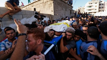 Palestinians protesting the gaza crisis which has lead to more than 1300 deaths