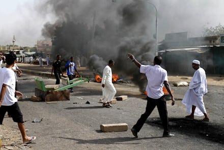 Group of people rioting in Sudan