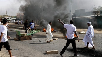 Group of people rioting in Sudan