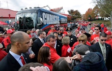 Republican Chris Christie getting out of a bus with his name
