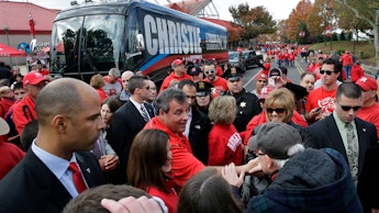 Republican Chris Christie getting out of a bus with his name