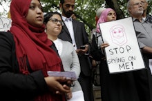 Muslims protesting against NYPD surveillance, holding signs that say: stop spying on me!