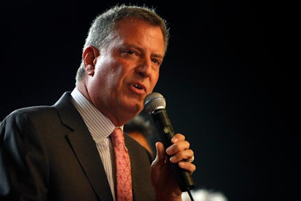 Bill de Blasio holding a microphone during his speech