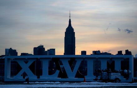 The Empire State Building, top, backdrops Roman numerals for the NFL Super Bowl XLVIII football game...