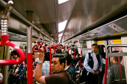 Commuters on an MTR train standing