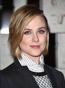 Evan Rachel Wood in a black blazer, striped button-up and sheer sweater