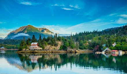 A natural lake and forest scenery in the State of Alaska