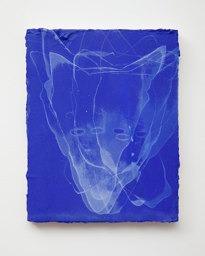 An abstract painting of a coyote on blue paper