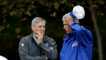 Terrence Pegula, owner of the Buffalo Bills, talking to a man during the NFL Week 7