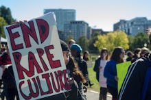 Protesters against violence culture holding an "end rape culture" banner