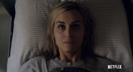 Piper Chapman lying in bed looking up at the ceiling
