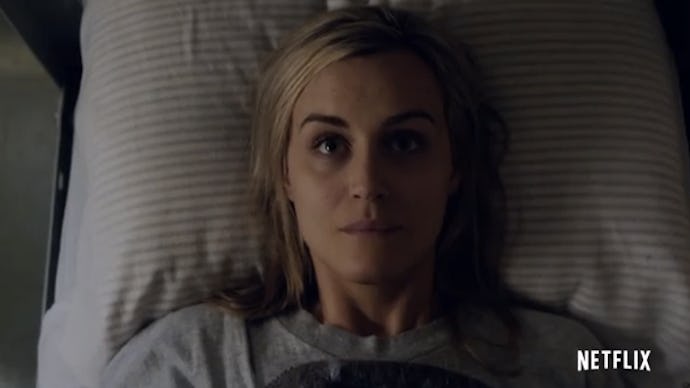 Piper Chapman lying in bed looking up at the ceiling