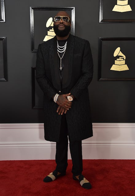 Rick Ross in a black coat and black pans at the Grammy Award Show