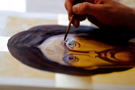 A man painting Jesus