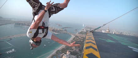 A screenshot from a video of a man jumping 1,358 feet from Dubai's Princess Tower