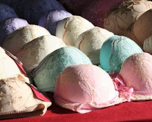 Various bras of different colors on a red surface in a try-on truck
