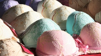 Various bras of different colors on a red surface in a try-on truck