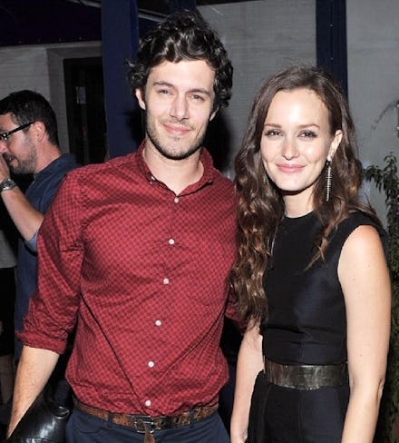 Leighton Meester and Adam Brody smiling while looking at the camera