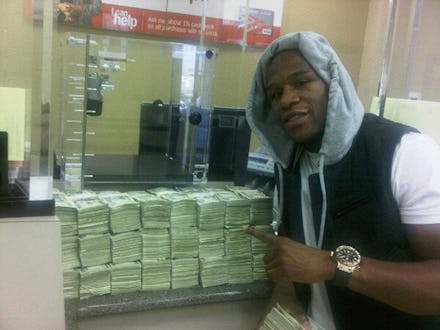 Floyd Mayweather posing with a lot of cash