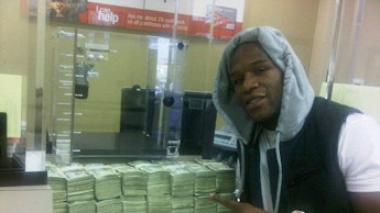 Floyd Mayweather posing with a lot of cash