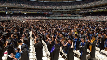 A large crowd with students during their graduation ceremony; a case for free college tuition
