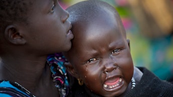 A South Sudanese boy crying