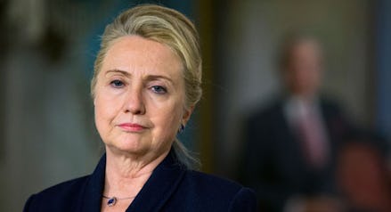 A closeup of Hillary Clinton in a black blazer with an up do