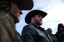 Oregon militia leader Ammon Bundy standing with three men