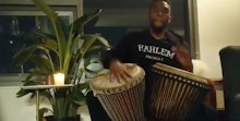 Chadwick Boseman playing drums