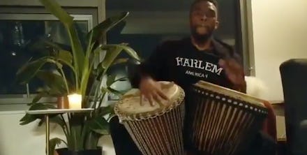 Chadwick Boseman playing drums