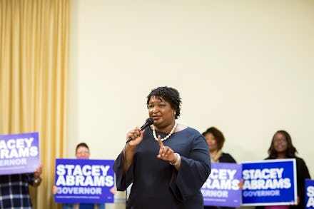 Democratic candidate for Georgia governor Stacey Abrams speaking in front of a crowd of supporters