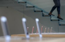 iPhones on tables in an Apple store