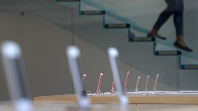 iPhones on tables in an Apple store