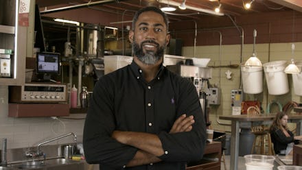 the owner of two Northwest Coffee Roasting Company stores in St. Louis, Jason Wilson posing in his ...
