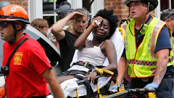 A woman injured in Charlottesville being taken away on a stretcher