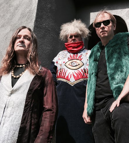 Melvins Frontman King Buzzo standing with the other two members