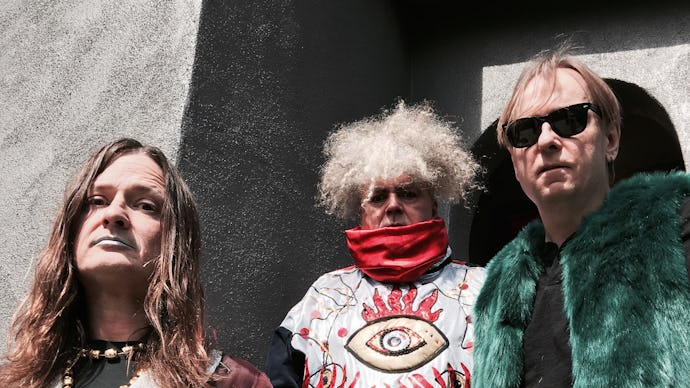 Melvins Frontman King Buzzo standing with the other two members 