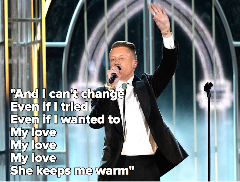 Macklemore performing on stage, with the lyrics to "Same Love"