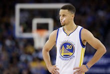 Stephen Curry, who doesn't want to go to the White House, standing at a basketball court during a ga...