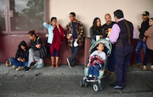 Immigrant parents with children applying for the Deferred Action for Childhood Arrivals (DACA) progr...