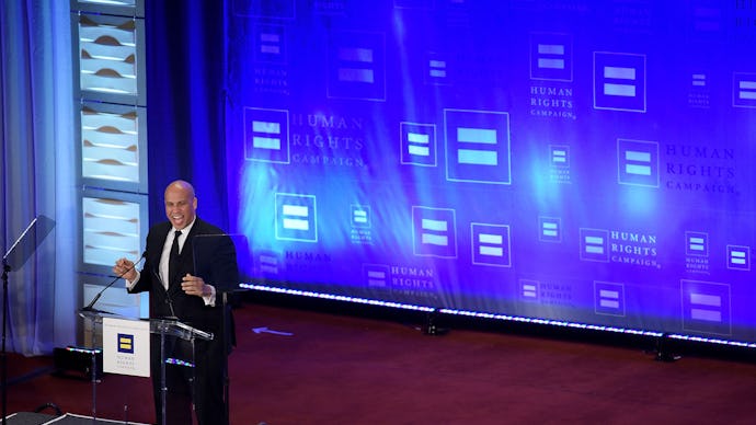 Sen. Cory Booker standing at a podium talking about the equality act
