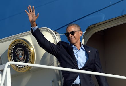 President Barack Obama waving to a crowd before going into air force one