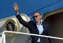 President Barack Obama waving to a crowd before going into air force one