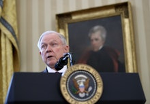 Jeff Sessions speaking on immigration at a podium