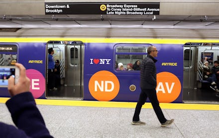 A man walking next to a subway after the NYC MTA Fare Increase in 2017