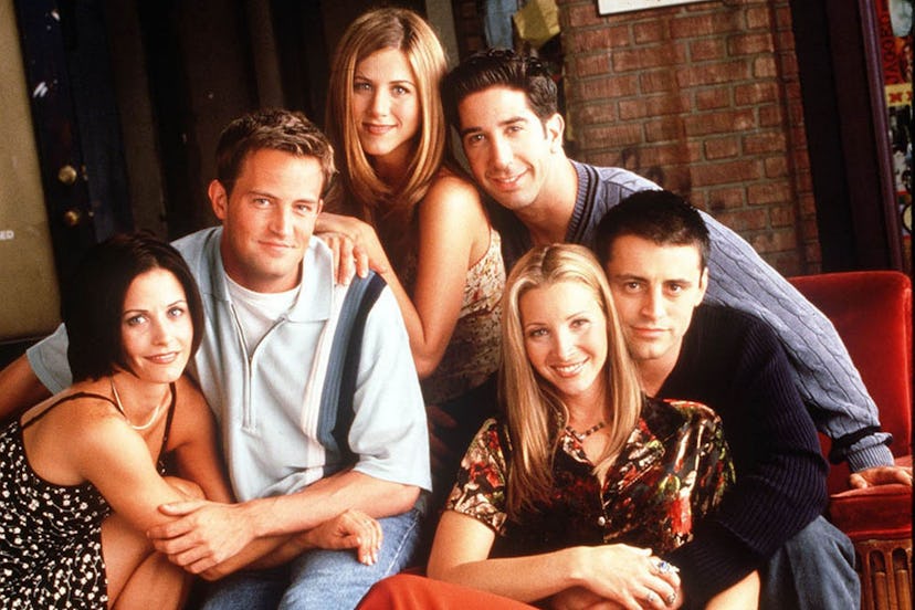 The 'Friends' cast seated together and posing