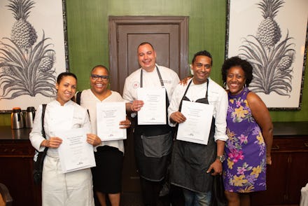 Four of America's best Black chefs posing for a picture with certificate awards