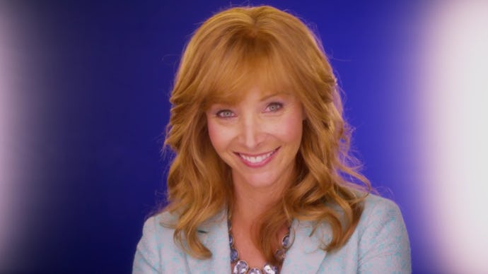 Lisa Kudrow with ginger hair in a light blue blazer